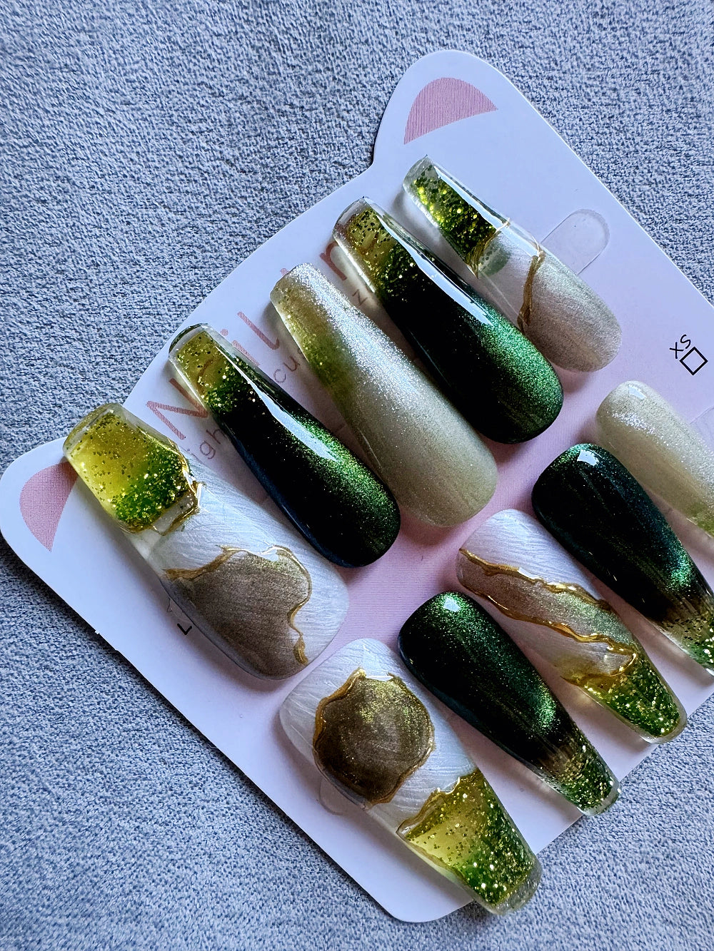 Emerald Pool Hand Drawn Elaborate Satin Gold Outline Emerald Cat Eye Flowing Sand Nail Art